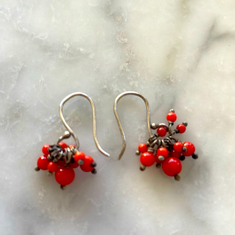 Dangle earrings with red orange beads